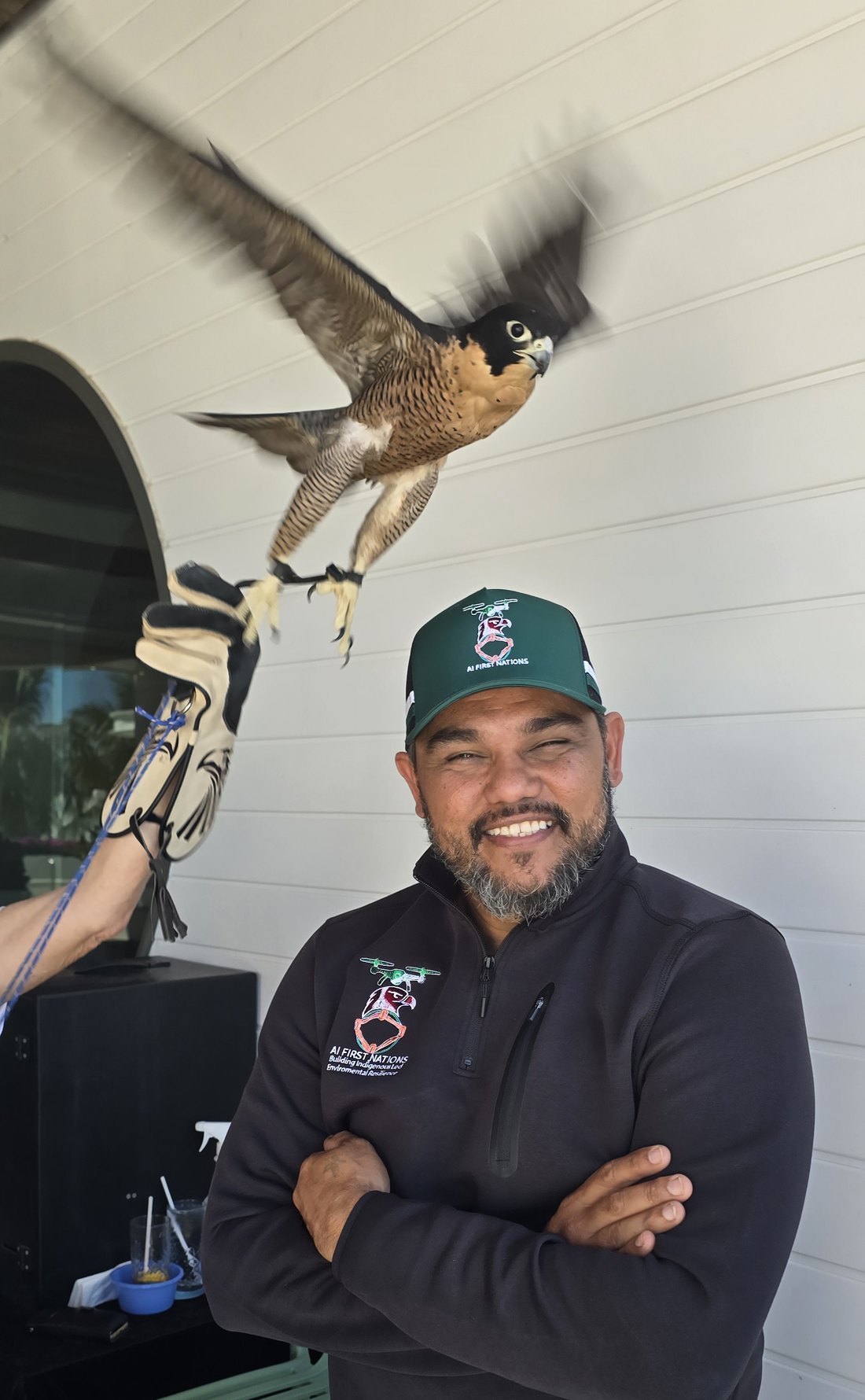 John Fejo wearing AI FIRST NATIONS branding with a falcon